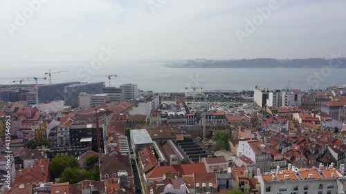 Aerial view of cranes and contruction, in Sao Bento, Lisbon - pan, drone shot photo