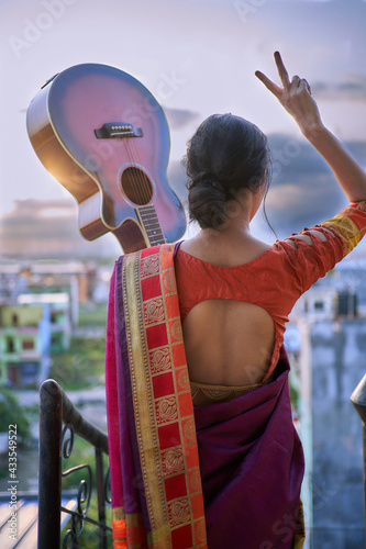 Beautiful girl holding guitar