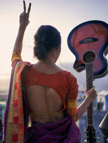 Beautiful girl holding guitar