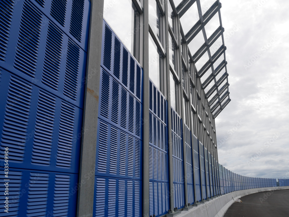 SELANGOR, MALAYSIA - JULY 5, 2020: Noise barriers are installed along the vehicle lane bordering the residence to prevent noise pollution to the surrounding locals.
SELANGOR, MALAYSIA - JULY 5, 2020: Noise barriers are installed along the vehicle lane bordering the residence to prevent noise pollution to the surrounding locals.
