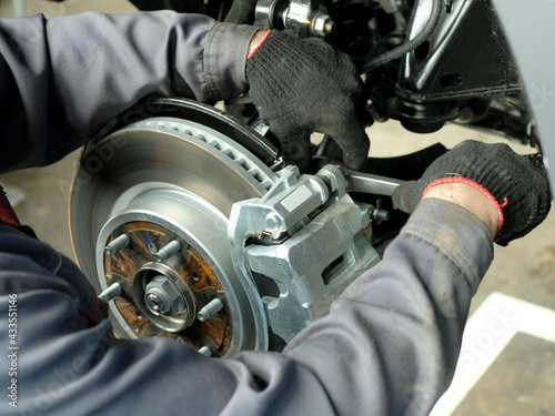 Cuadro en lienzo Front brake disc, brake pads assembly, brake caliper close-up
