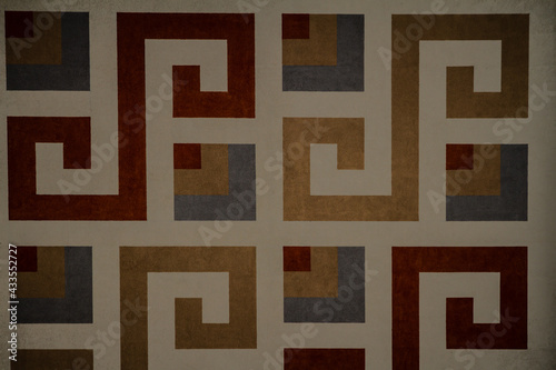 beautiful geometric patterns on the wall of a new brick multi-storey building