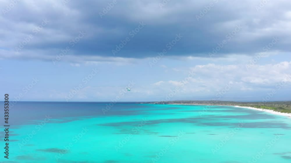 Helicopter flying over turquoise Caribbean sea. Aerial tracking Helicopter flying over turquoise Caribbean sea. Aerial tracking