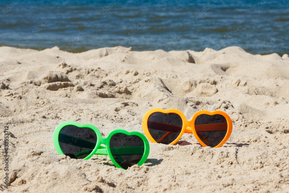 Sunglasses as protection from sun at beach. Travel and vacation time