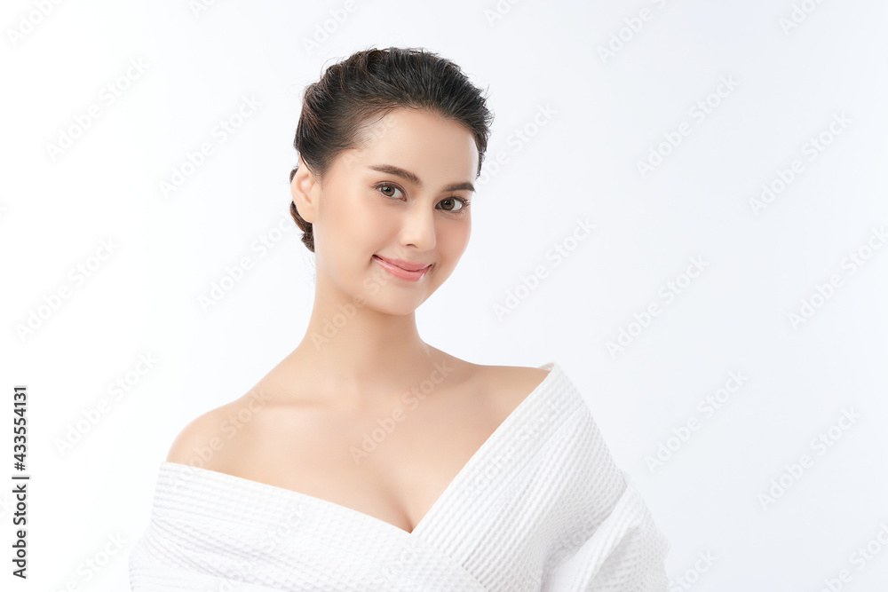 Beautiful young Asian woman wearing bathrobe on white background, Face care, Facial treatment, Cosmetology, beauty and spa Concept. Beautiful young Asian woman wearing bathrobe on white background, Face care, Facial treatment, Cosmetology, beauty and spa Concept.