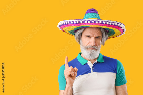 Senior man in sombrero hat ...