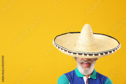 Senior man in sombrero hat ...