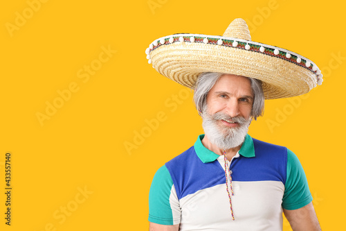 Senior man in sombrero hat ...