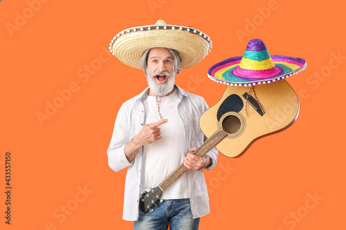 Senior man in sombrero hat ...