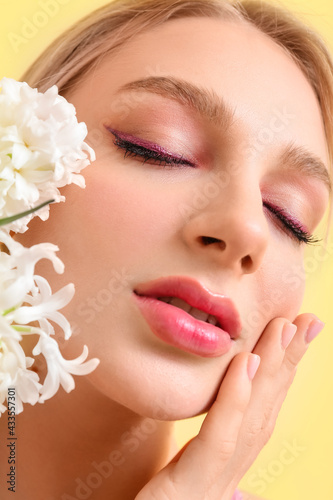 Beautiful young woman with ...