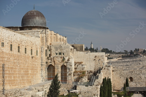 Historical wall in Jerusalem and Temple Mount with cupola of Al-Aqsa mosque
