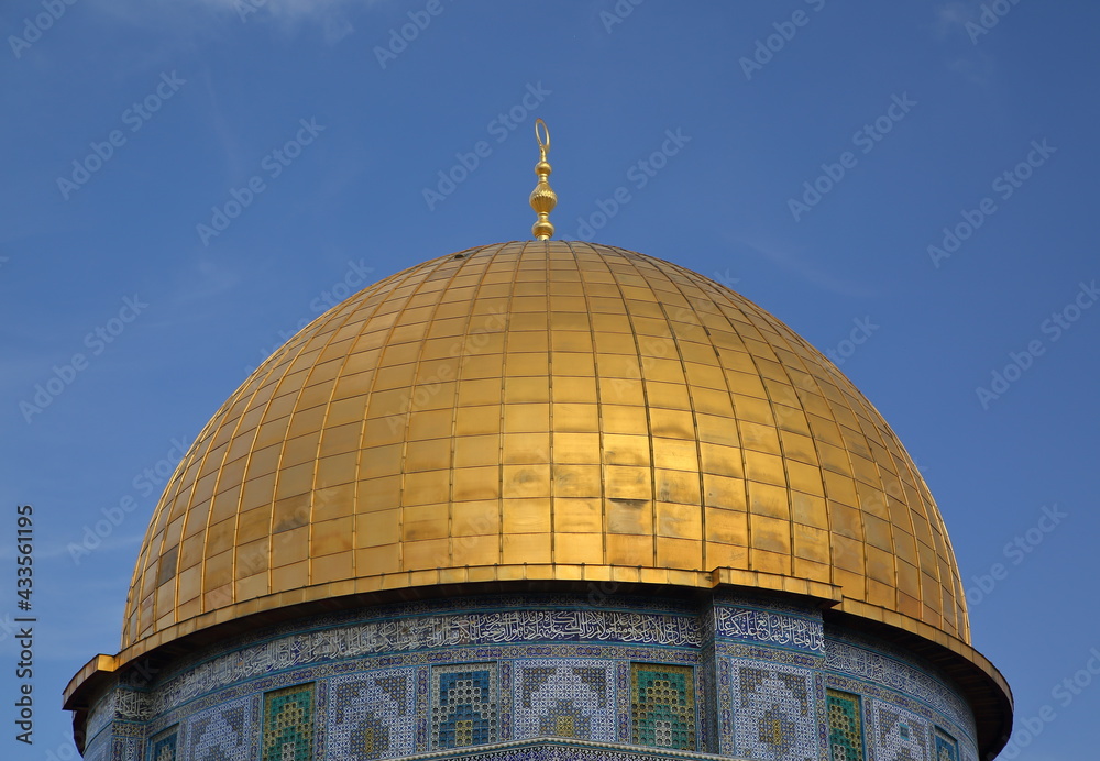 Golden cupola of Dome on the Rock in Jerusalem, agianst blue sky