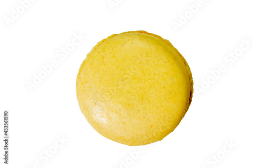 Lemon flavor homemade yellow macaron isolated on a white background, top view