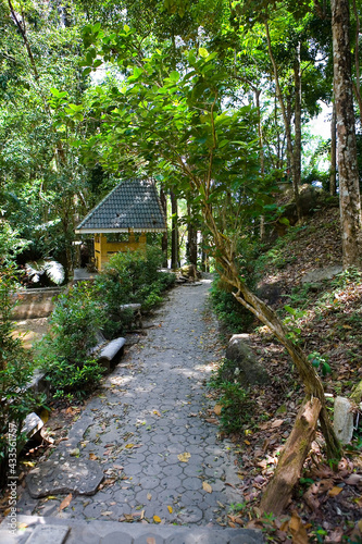 Park with a walkway and a gazebo.