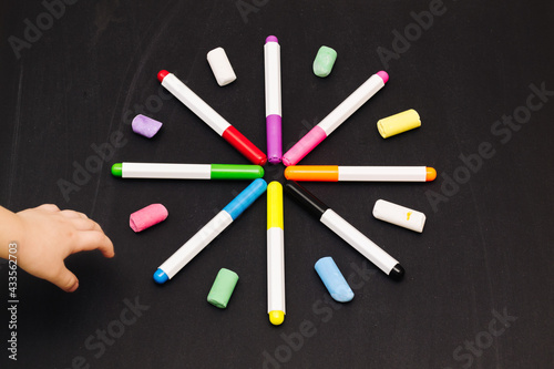 Markers with crayons in the shape of a beautiful big star. Teaching children to draw.