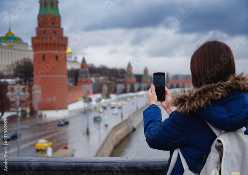 Asian tourist in travel vacations in winter Moscow