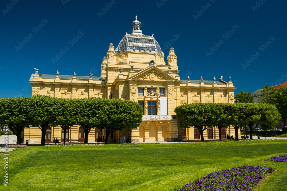 Art gallery and flowers in foreground, beautiful spring day, central Zagreb, Croatia