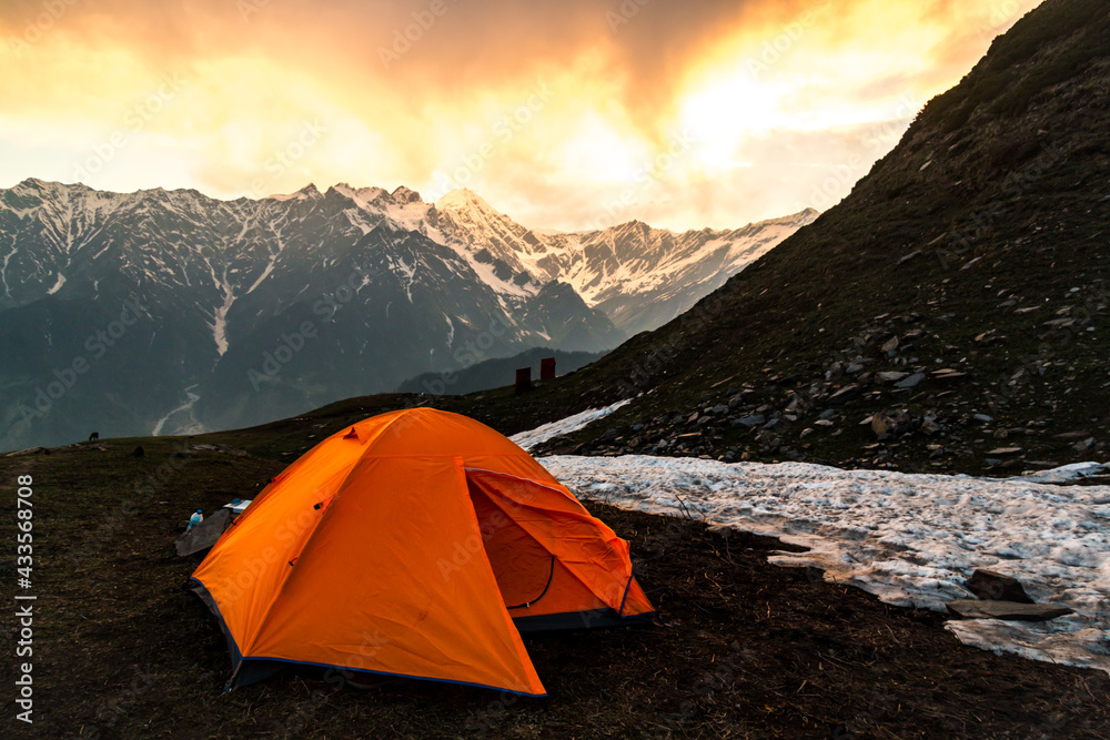 Tent at a campsite at the edge of the Himalayas, seen at sunset, on the Bhrigu Lake trek in northern India