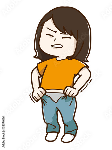 きつくて入らないズボンを頑張って履こうとする女性
