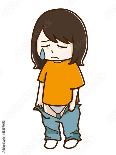 久しぶりに履くズボンが入らなくて悲しむ女性

