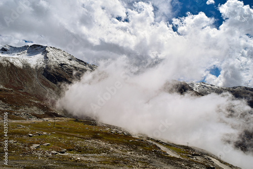 When the clouds touches the mountains. A view when you visit to Rohtang Pass located in Manali- India