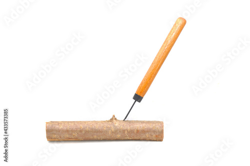 Wooden block and wood cutter on white background close-up