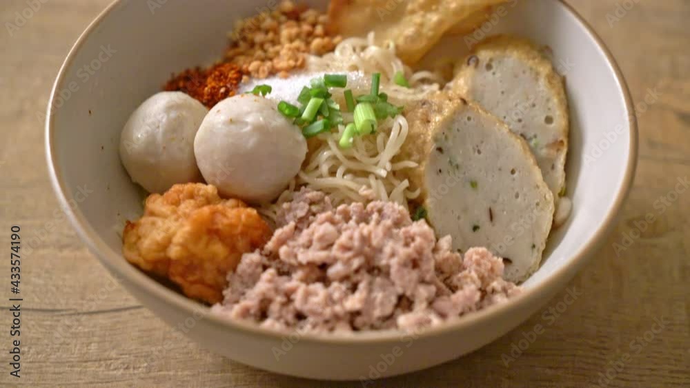spicy egg noodles with fish balls and shrimp balls without soup - Asian food style spicy egg noodles with fish balls and shrimp balls without soup - Asian food style