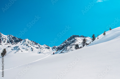 A man walk into the snow of mountain