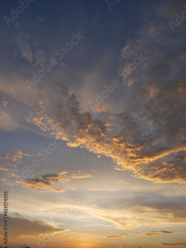 Gold color cloud and blue sky in magic hour at sunset, The horizon began to turn orange with purple clouds at night, Dramatic cloudscape area