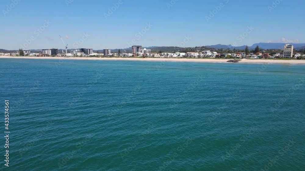 Panorama Of Blue Sea With Palm Beach Coastal Suburb In Gold Coast, QLD, Australia. - aerial approach Panorama Of Blue Sea With Palm Beach Coastal Suburb In Gold Coast, QLD, Australia. - aerial approach