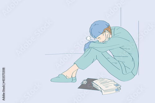 Tired exhausted male nurse or doctor, Virus outbreak. Coronavirus pandemic. Clinic and hospital medical stuff working over hours. Overworked professional.