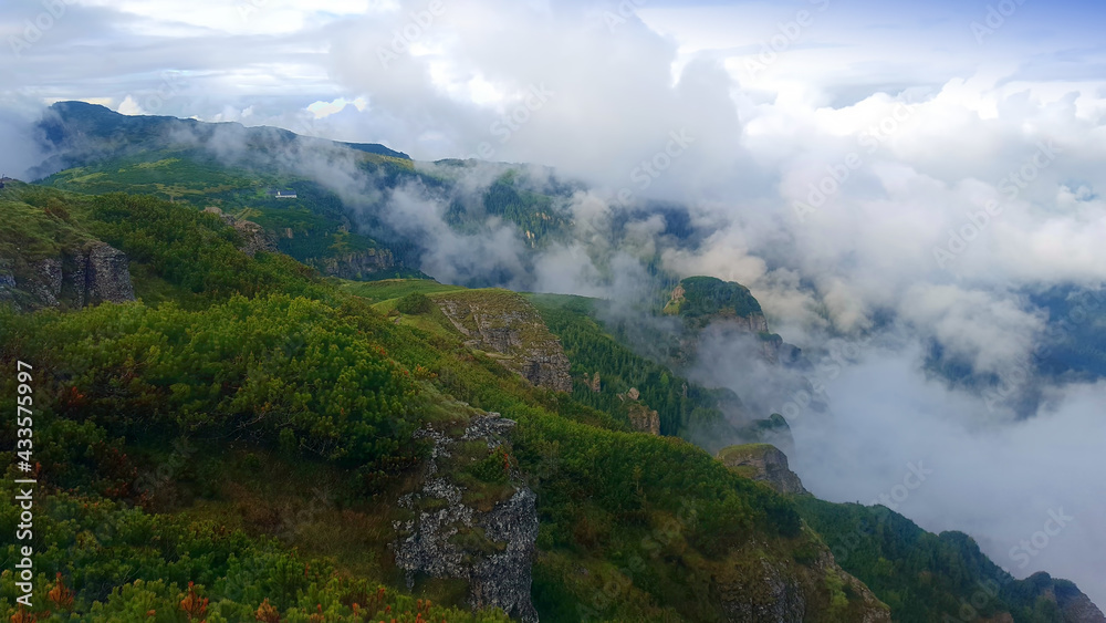 Mountain landscape after rain. cloudy scene in Ceahlau, Romania