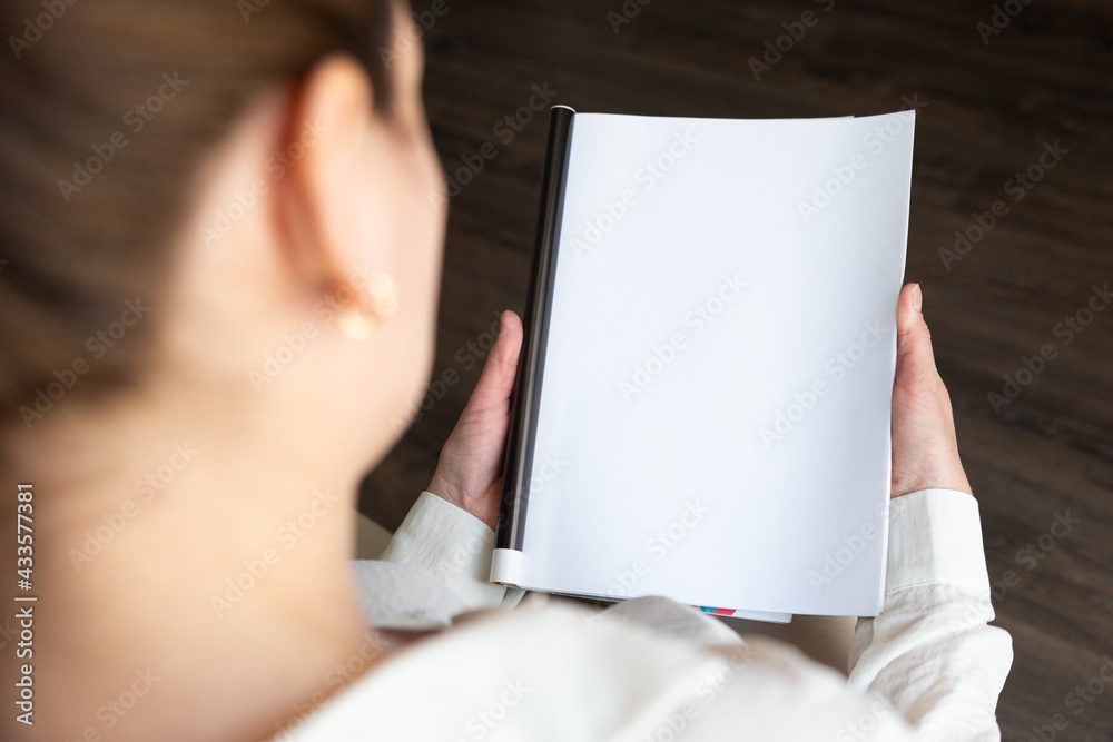 Female hands open blank catalog, magazines, book mock up Female hands open blank catalog, magazines, book mock up