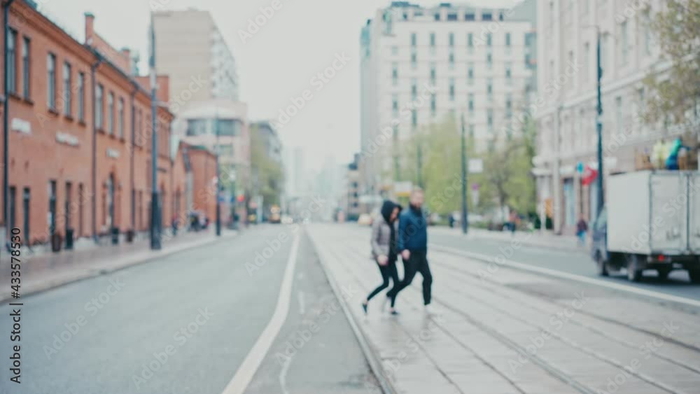 Defocused abstract background. View of the road and tram tracks in the historic city center. Defocused abstract background. View of the road and tram tracks in the historic city center.
