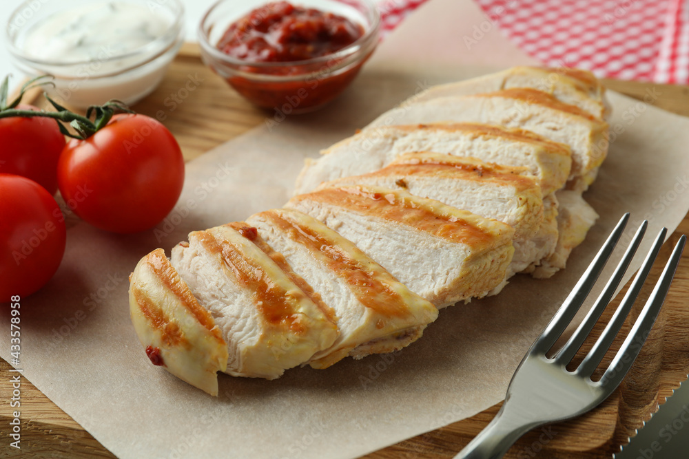 Concept of tasty eating with grilled chicken, close up Concept of tasty eating with grilled chicken, close up