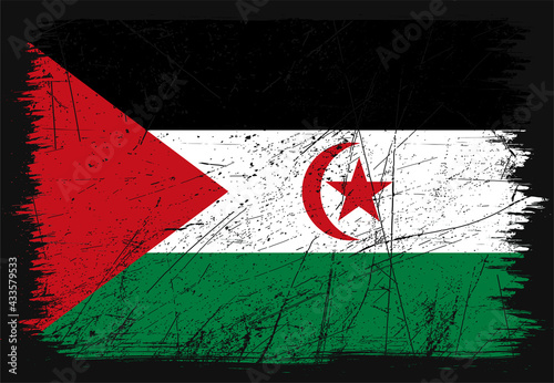 Creative grunge flag of Western Sahara country. Happy independence day of Western Sahara. Brush flag on shiny black background