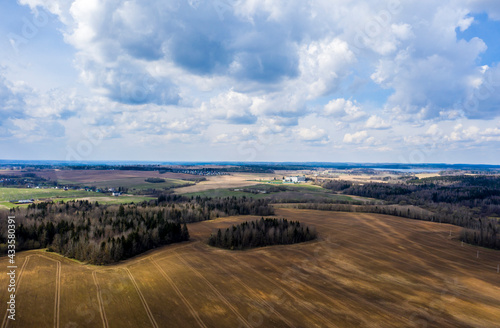 Aerial view of agricultural landscape with fields in spring season.