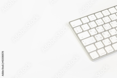 Aluminum computer keyboard wireless connection. Beautiful modern design, isolated on white background.