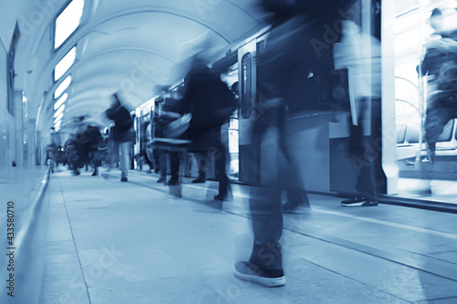 crowd of people metro in motion blurred, abstract background urban traffic people