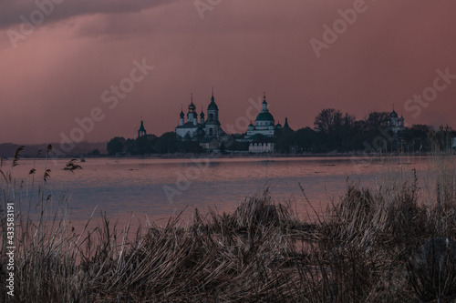 View of Spaso-Yakovlevsky Monastery in Rostov Veliky from Nero's lake on a sunset
