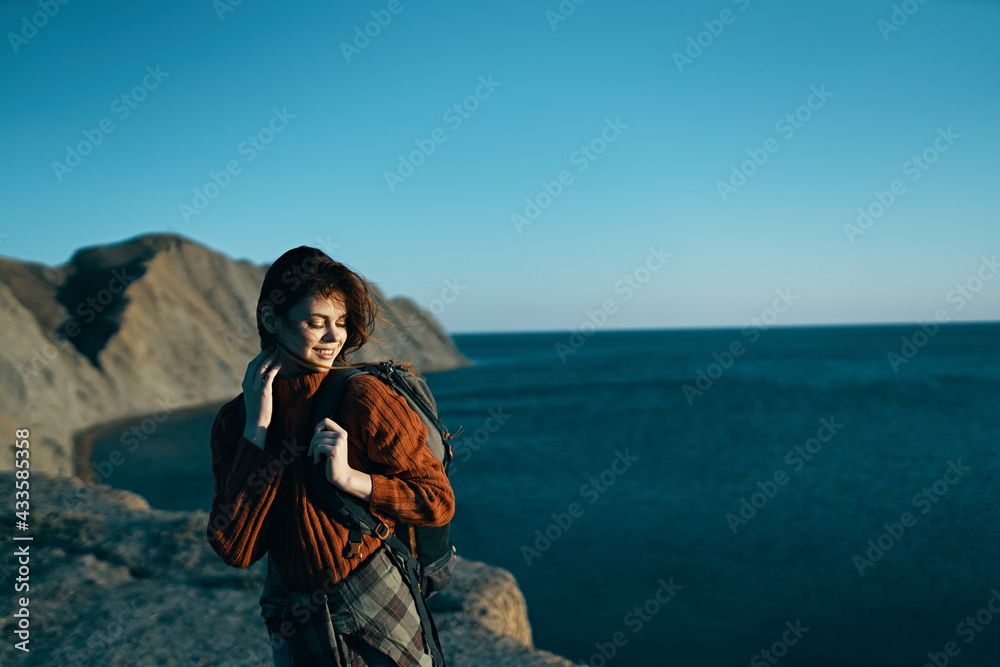 woman outdoors summer travel to mountains blue sky