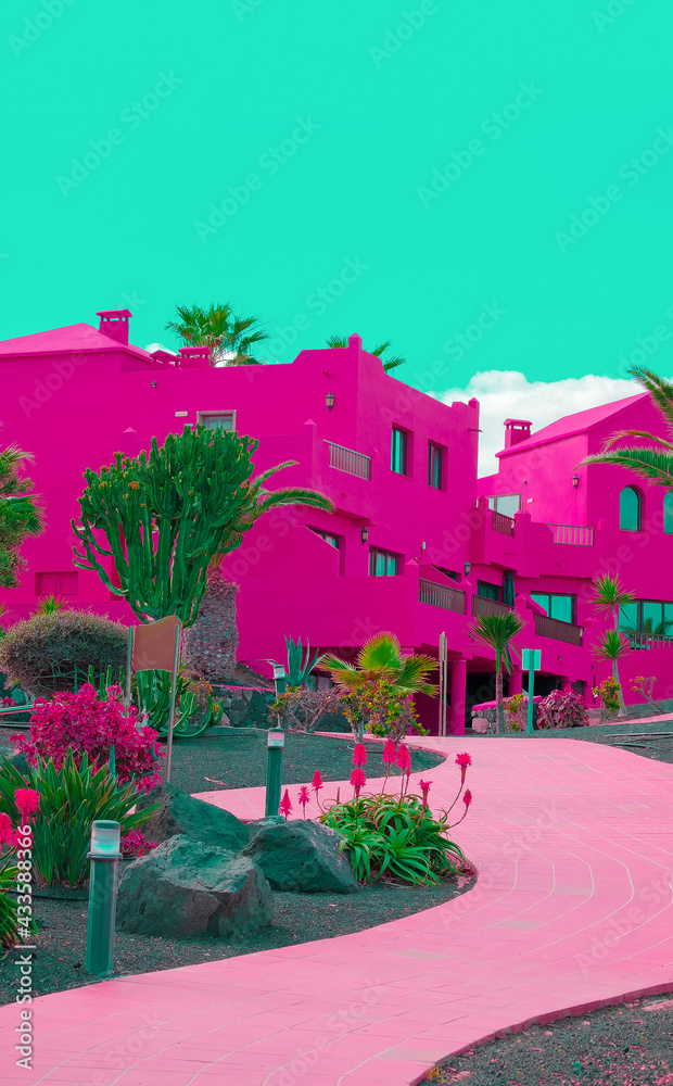 Fashion tropical location. Pink Hotel. Palm garden. Blue summer sky. Canary islands. Travel advertising banner wallpaper