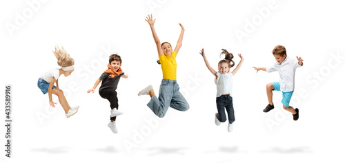 Art collage made of portraits of little and happy kids isolated on white studio background. Human emotions, facial expression concept