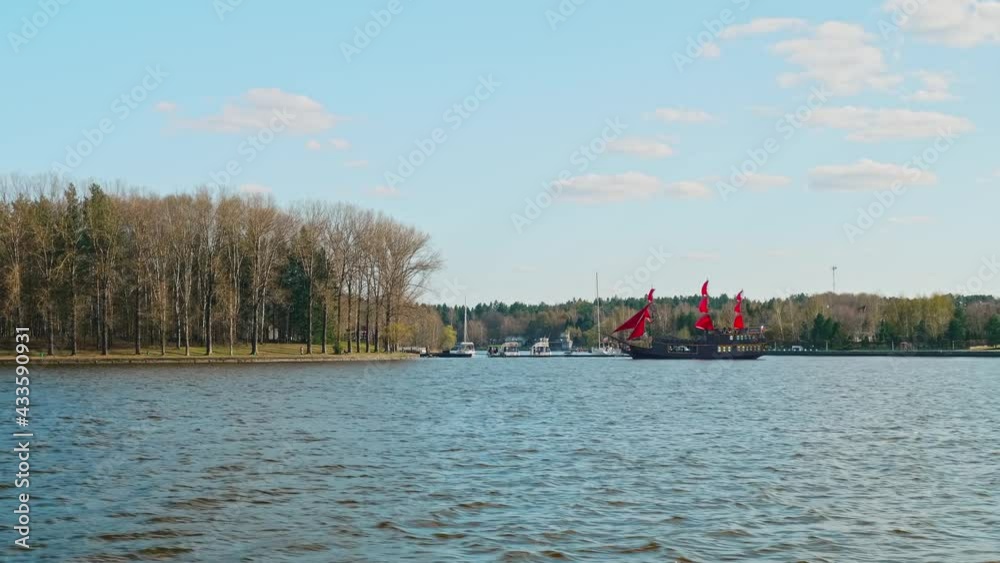 Panoramic view of reservoir with yachts and ships on it. Spring day and navigation beginning. Panoramic view of reservoir with yachts and ships on it. Spring day and navigation beginning.