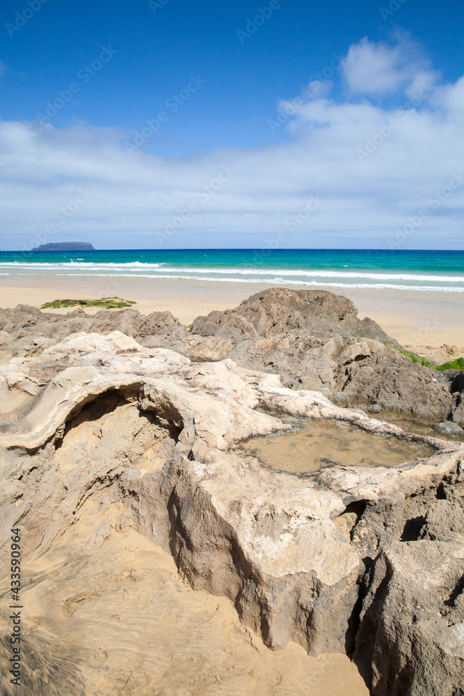 Coastal rocks on a beach of Porto Santo