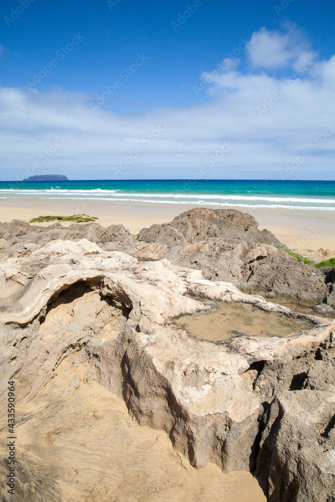 Coastal rocks on a beach of Porto Santo Coastal rocks on a beach of Porto Santo