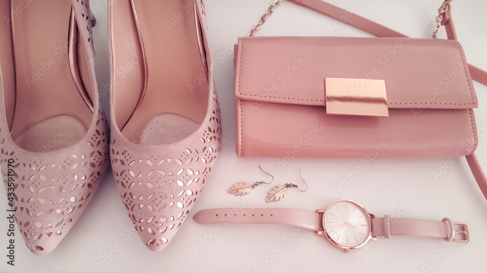 Closeup of pink and rose gold beauty fashion items accessories, watch, earrings, pumps and clutch, outfit for a wedding, accessory and clothing Closeup of pink and rose gold beauty fashion items accessories, watch, earrings, pumps and clutch, outfit for a wedding, accessory and clothing