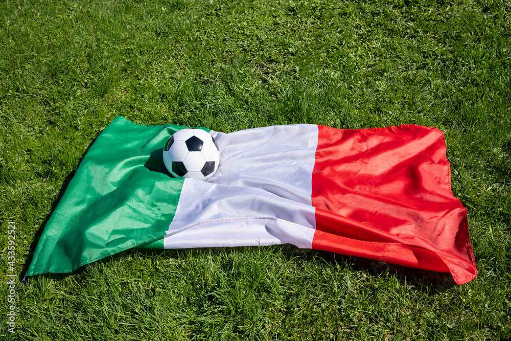 soccer ball on background of Italian flag on green grass European Championship 2021 opening