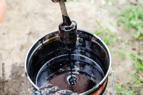 bitumen in the bucket photo