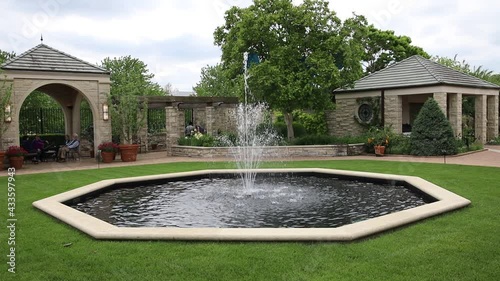 KANSAS CITY, MO, UNITED STATES - May 08, 2021: Beautiful fountain at Kauffman Gardens.

The Ewing and Muriel Kauffman Memorial Garden
4800 Rockhill Rd, Kansas City, MO 64110 photo